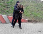 Policeman in civvies detaining a female demonstrator